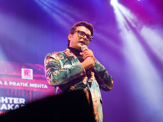 Navin Prabhakar anchoring a corporate performance