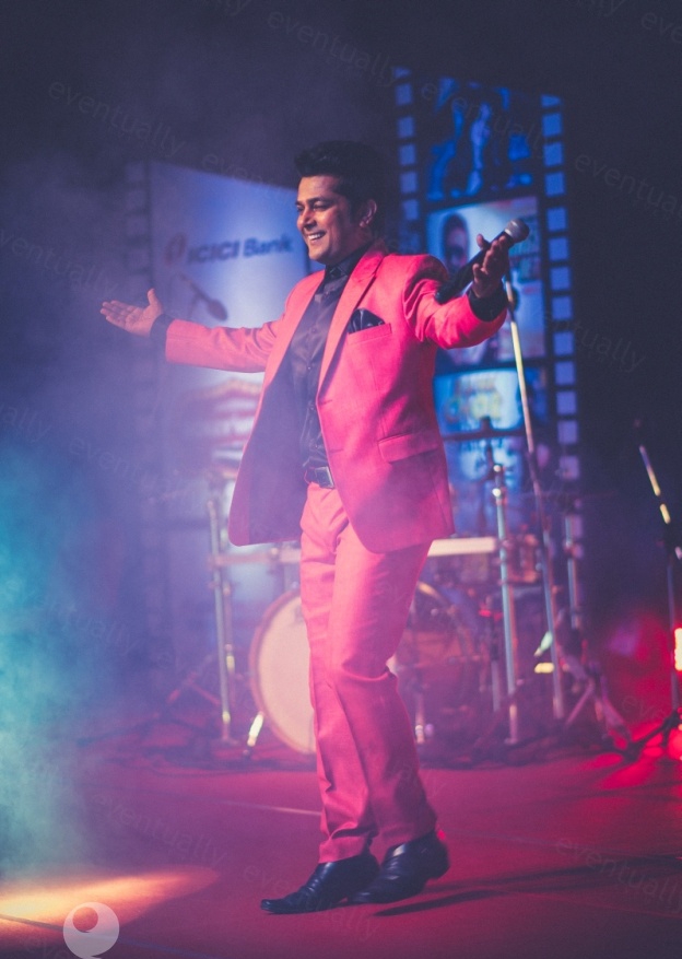 Navin Prabhakar performing stand-up comedy on stage