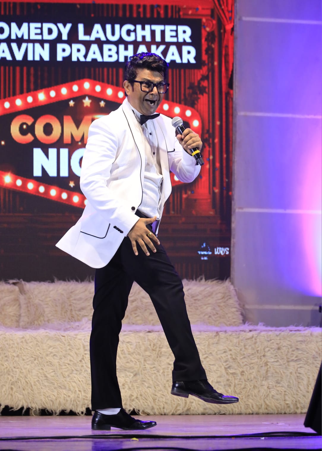 Navin Prabhakar anchoring a corporate event