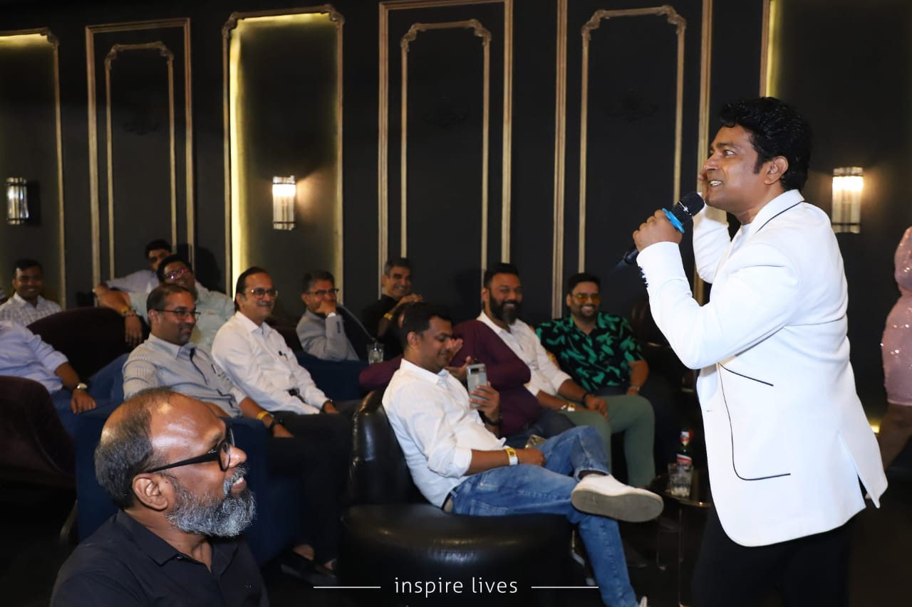 Navin Prabhakar on stage during a corporate solo performance