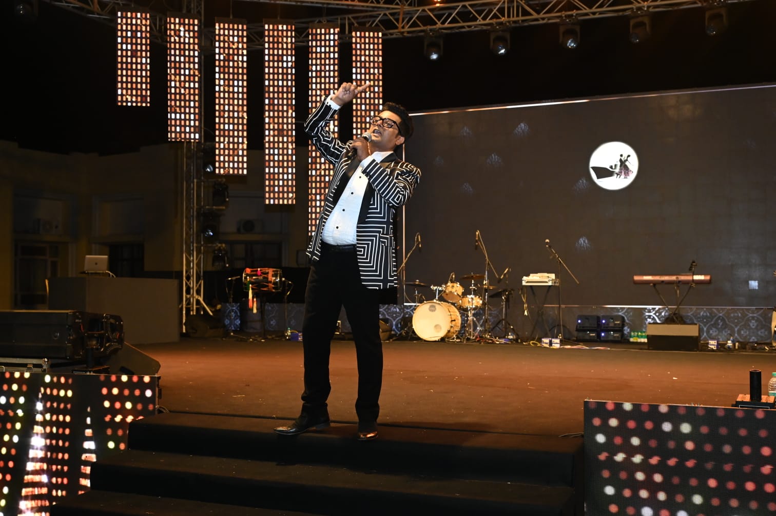 Navin Prabhakar anchoring a corporate performance